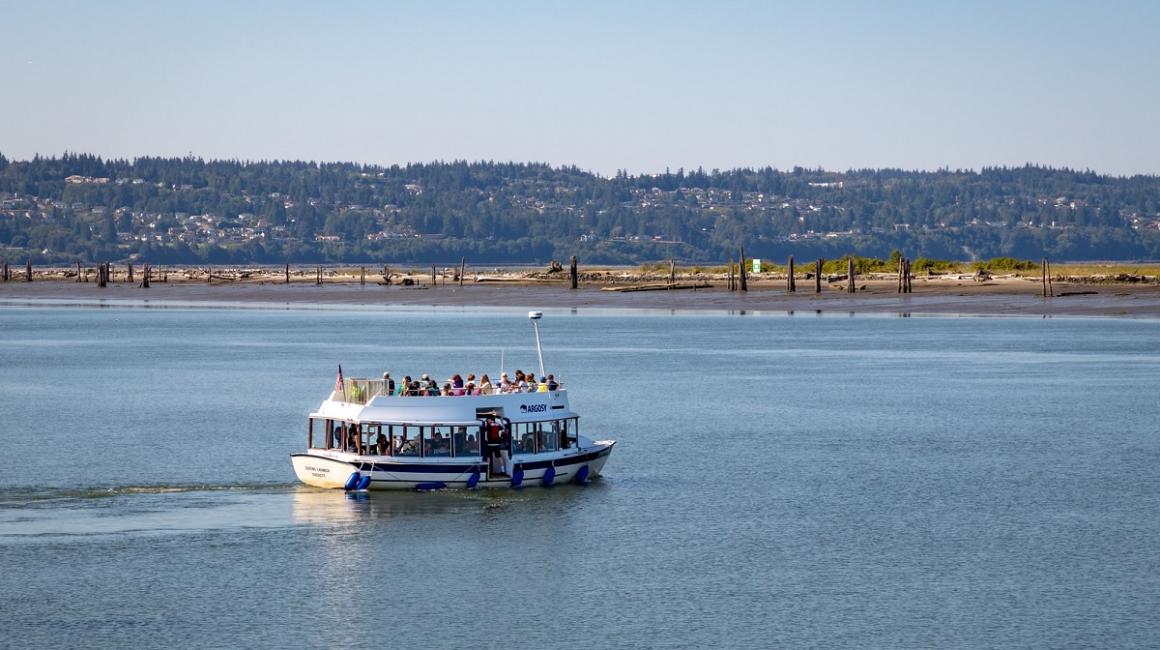 View of the passenger ferry on its way to Everett's Jetty Island, fun Puget Sound beach for kids and families near Seattle